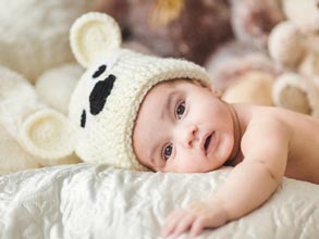 Newborn with a cute teddy bear hat